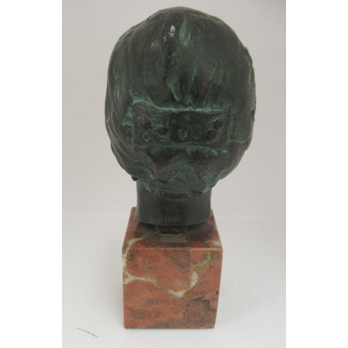 39 - A cast and patinated green bronze bust, a young woman  stamped P Gambino, on a mottled marble p... 