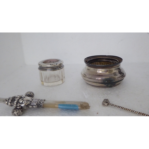 396 - Silver and silver coloured metal items: to include a cut glass caster with a threaded cap; a babies ... 