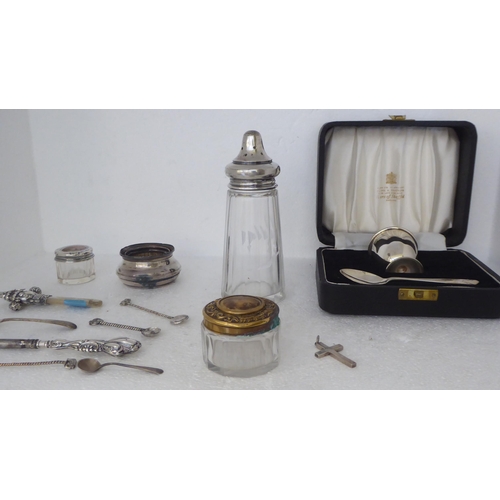 396 - Silver and silver coloured metal items: to include a cut glass caster with a threaded cap; a babies ... 