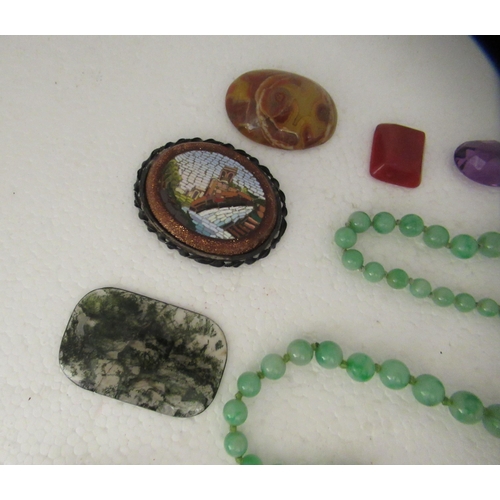 40 - Items of personal ornament: to include two green jade graduated bead necklaces; and an oval micro-mo... 