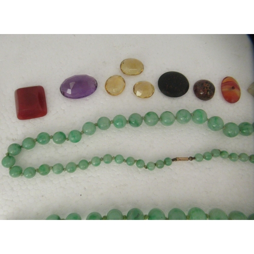 40 - Items of personal ornament: to include two green jade graduated bead necklaces; and an oval micro-mo... 