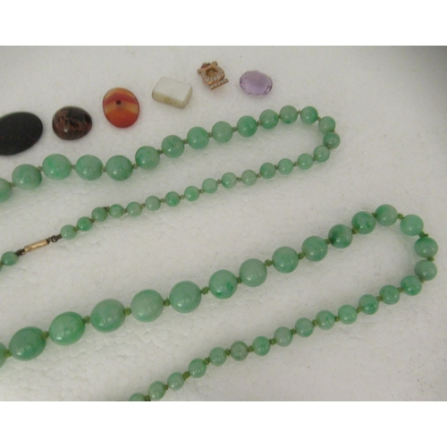 40 - Items of personal ornament: to include two green jade graduated bead necklaces; and an oval micro-mo... 