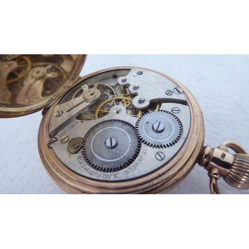 401 - A Dennison 9ct gold cased half-hunter pocket watch, the keyless 15 jewel movement faced by a white e... 