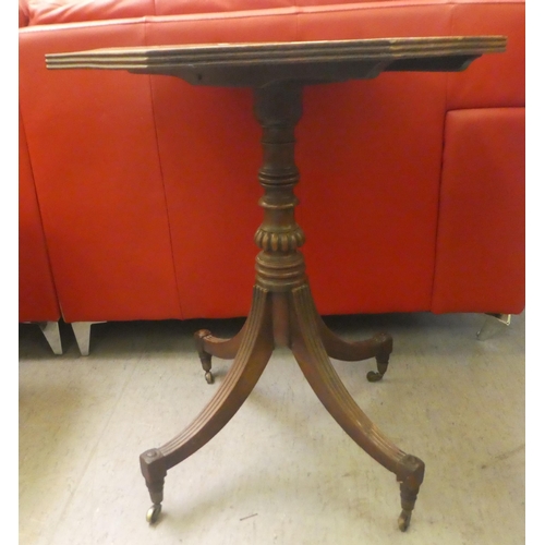 404 - A William IV octagonal mahogany tip-top pedstal table, raised on a splayed quadruped base and caster... 