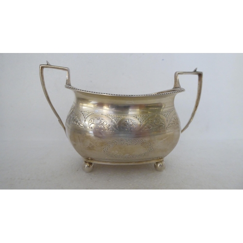 408 - 19thC silver teaware, viz. an embossed oval sugar basin; and a panelled example with twin handles, o... 