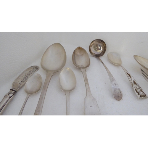 410 - Silver flatware: to include fiddle pattern dessert spoons; and assorted teaspoons  mixed marks