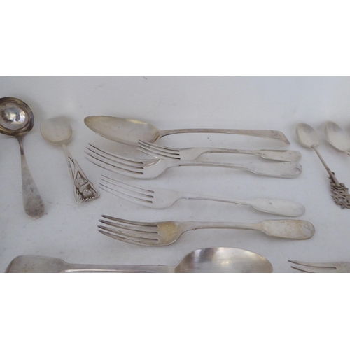 410 - Silver flatware: to include fiddle pattern dessert spoons; and assorted teaspoons  mixed marks