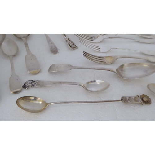 410 - Silver flatware: to include fiddle pattern dessert spoons; and assorted teaspoons  mixed marks