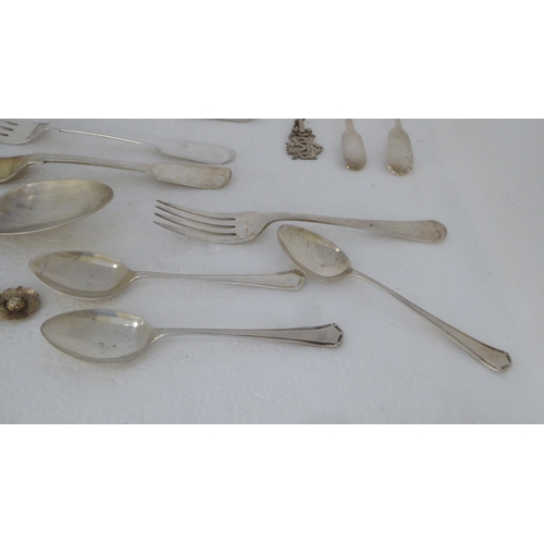 410 - Silver flatware: to include fiddle pattern dessert spoons; and assorted teaspoons  mixed marks