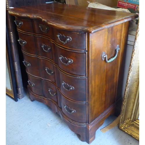 414 - A 19thC style Continental hardwood, serpentine front dressing chest, comprising four long drawers wi... 