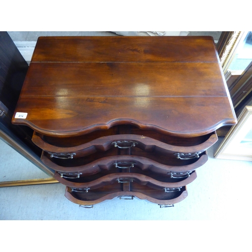 414 - A 19thC style Continental hardwood, serpentine front dressing chest, comprising four long drawers wi... 