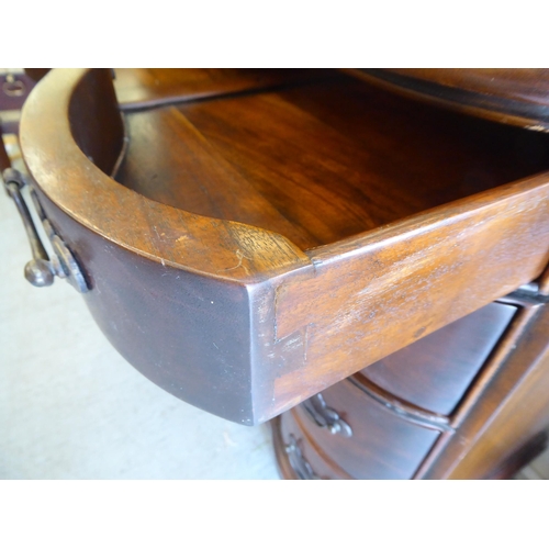 414 - A 19thC style Continental hardwood, serpentine front dressing chest, comprising four long drawers wi... 