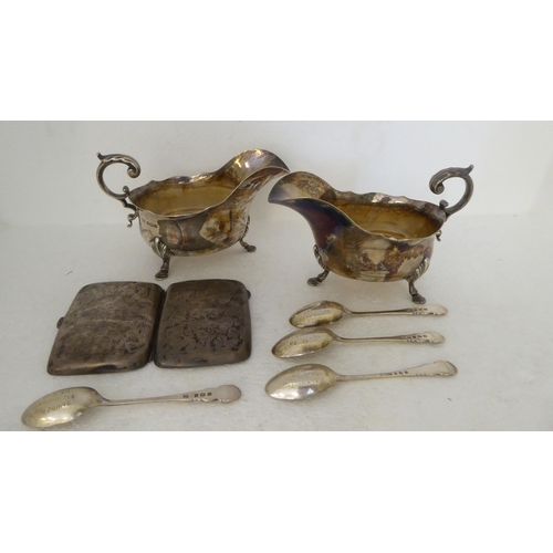 418 - Silver collectables: to include a pair of sauce boats, raised on pad feet  Sheffield 1923 