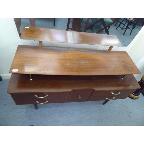 421 - An Austinsuite mahogany finished dressing table, surmounted by a tilting mirror, featuring an upstan... 