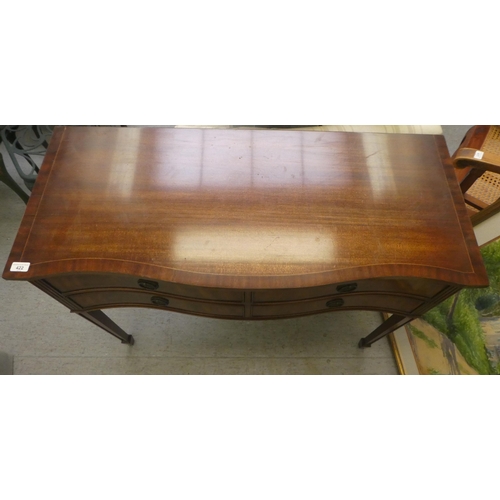 422 - A Regency style mahogany finished serpentine front, four drawer serving table, raised on square, tap... 