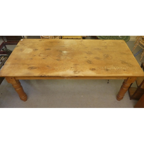 436 - A pine farmhouse table, raised on turned legs  31