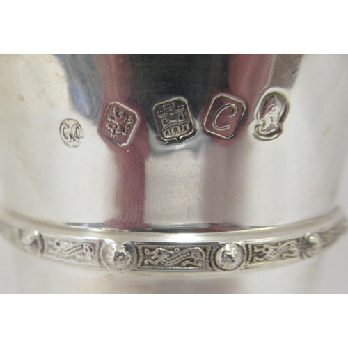 48 - A Scottish silver beaker with a flared rim and cast with Celtic band  Edinburgh 1977