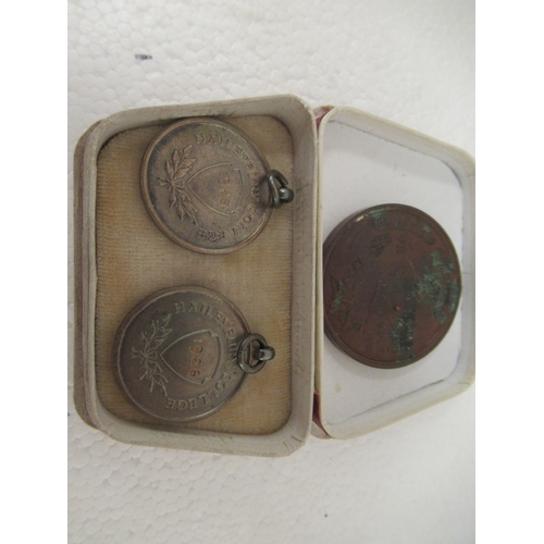 63 - A mixed lot: to include an early 20thC pocket barometer; and two silver swimming medallions 