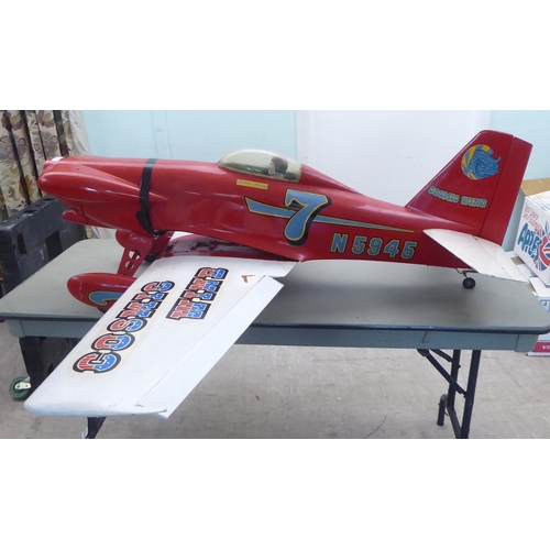 76 - A mid 20thC Cosmic Wind scratch built model aeroplane with a 66