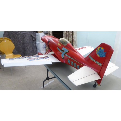 76 - A mid 20thC Cosmic Wind scratch built model aeroplane with a 66