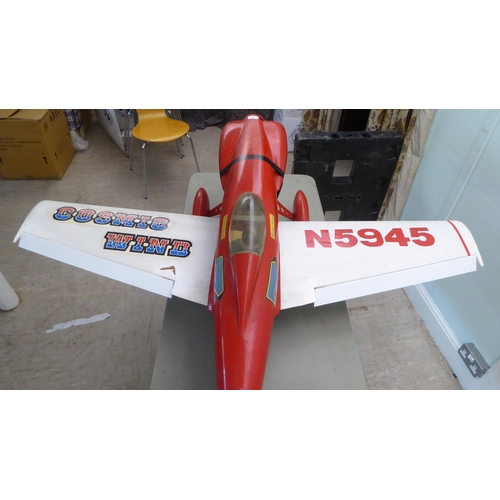 76 - A mid 20thC Cosmic Wind scratch built model aeroplane with a 66