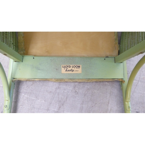 77 - A green painted Lloyd Loom Lusty tub chair, raised on splayed legs