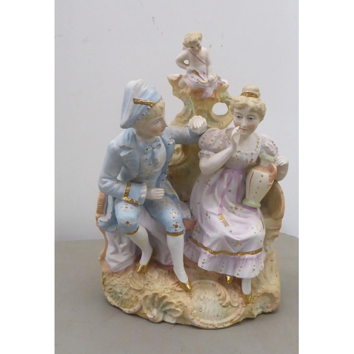 89 - Five 20thC Continental china figures: to include two children reading a book, on a rock  6