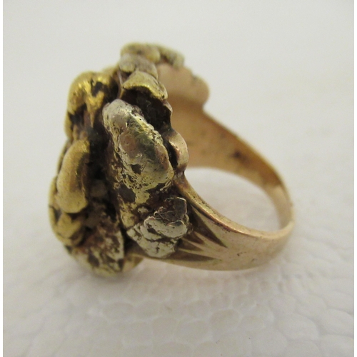 99 - A 10ct gold ring shank, mounted with a gold nugget