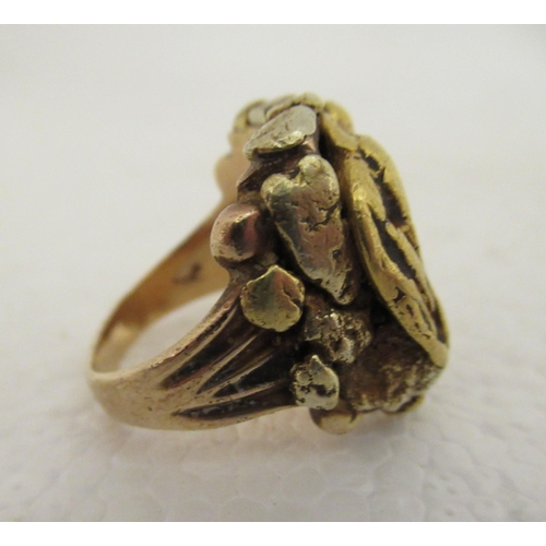 99 - A 10ct gold ring shank, mounted with a gold nugget