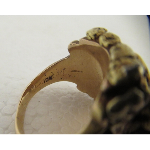 99 - A 10ct gold ring shank, mounted with a gold nugget