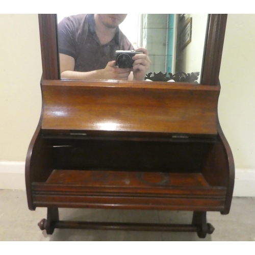 313 - A late Victorian mahogany bathroom cabinet with a mirror, over a hinged compartment and towel rail  ... 