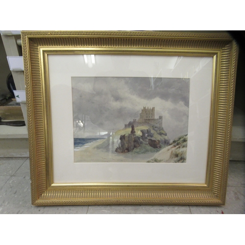 415 - Four framed pictures: to include a castle on a headland by a shoreline  watercolour  10