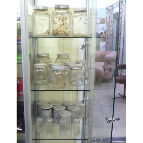 115 - A modern, fully glazed and shelved retailer's display cabinet with a single door, on casters  75