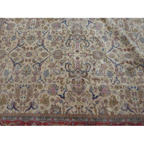 380 - A Persian carpet, decorated with floral designs and a stylised border, on a multi-coloured ground&nb... 