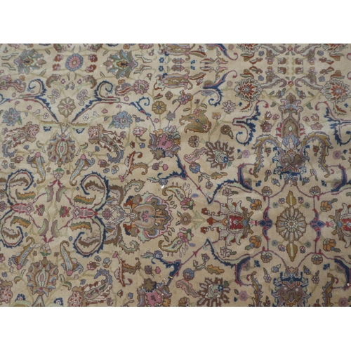 380 - A Persian carpet, decorated with floral designs and a stylised border, on a multi-coloured ground&nb... 