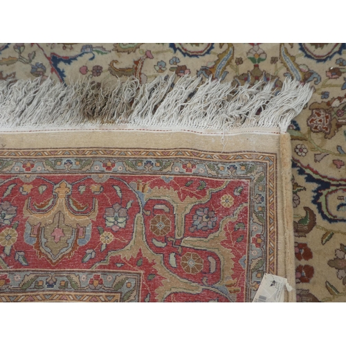 380 - A Persian carpet, decorated with floral designs and a stylised border, on a multi-coloured ground&nb... 