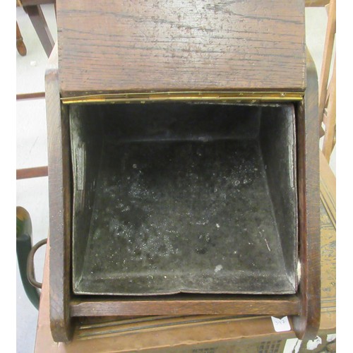 397 - Hearth related items: to include a 1920s oak coal hood; and an embossed, two handles copper log bin ... 