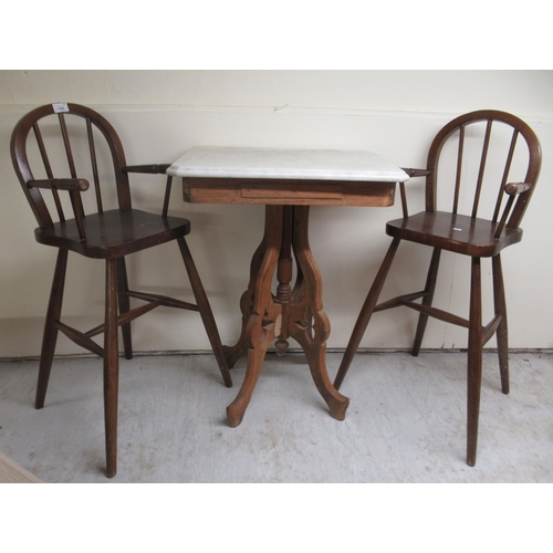 105 - Small furniture: to include a pair of 20thC child's stained beech highchairs, raised on turned legs&... 