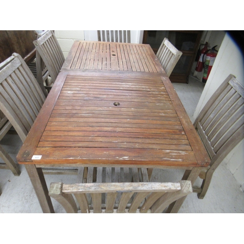 117 - A pair of weathered teak garden tables  29