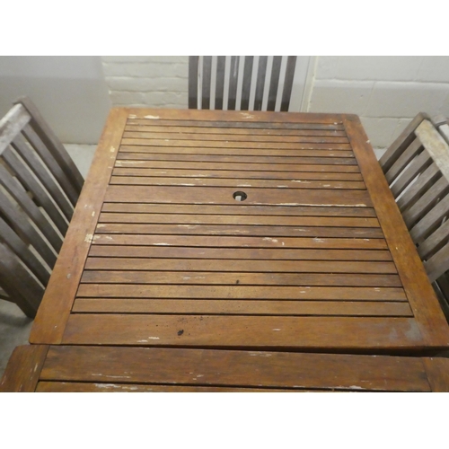 119 - A pair of weathered teak garden tables  29