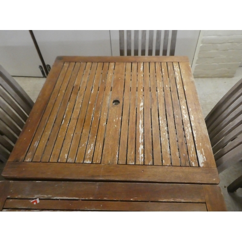 120 - A pair of weathered teak garden tables  29