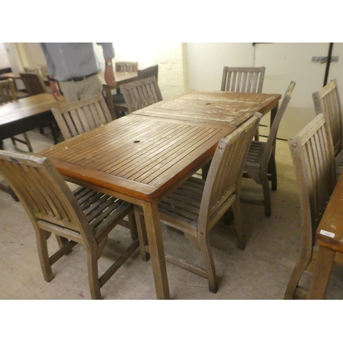 121 - A pair of weathered teak garden tables  29