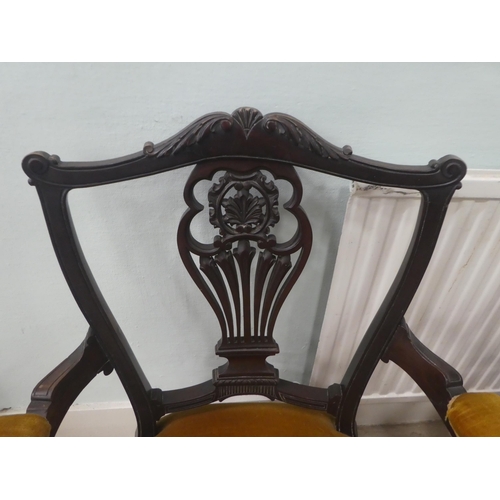 18 - A pair of Edwardian mahogany framed open arm salon chairs, upholstered in old gold fabric, raised on... 