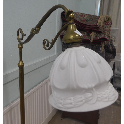 2 - A mid 20thC lacquered brass standard lamp with a C-scrolled arm, on a splayed tripod base  55