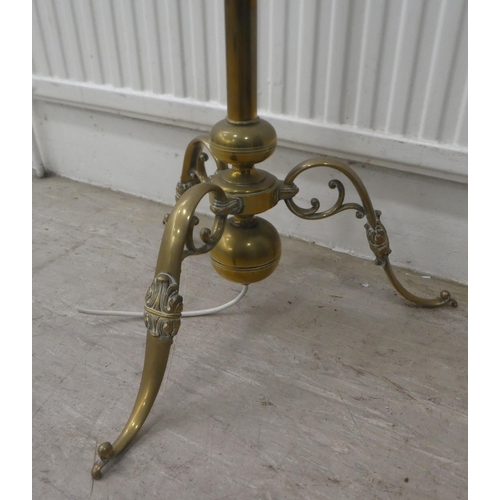 2 - A mid 20thC lacquered brass standard lamp with a C-scrolled arm, on a splayed tripod base  55