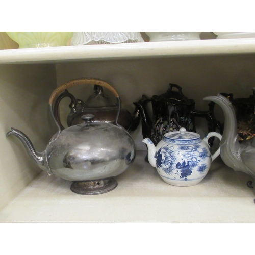 21 - China teapots, decorated in individual designs