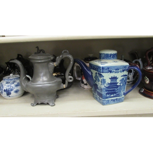 21 - China teapots, decorated in individual designs