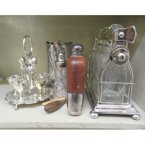 316 - Silver plated table and other wares: to include a late Victorian egg cruet on an attendant stand; an... 