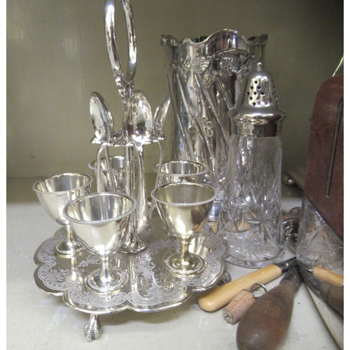 316 - Silver plated table and other wares: to include a late Victorian egg cruet on an attendant stand; an... 