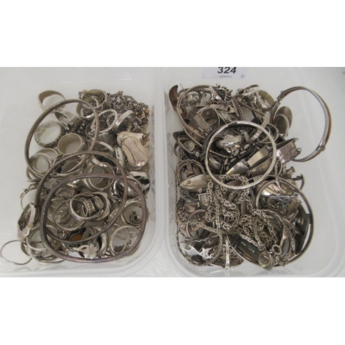 324 - Silver coloured metal jewellery: to include rings, medallions and bangles 